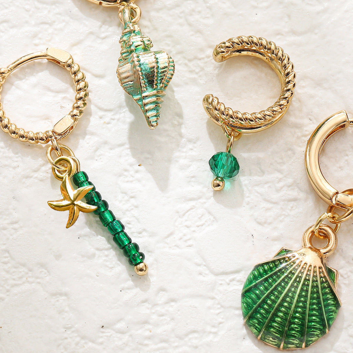 4 piece of niva earrings and ear studs