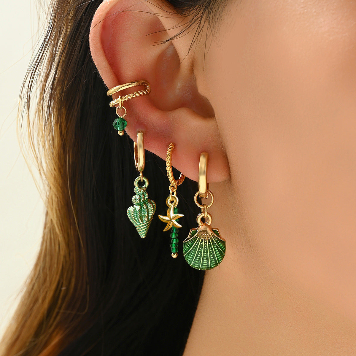 4 piece of niva earrings and ear studs