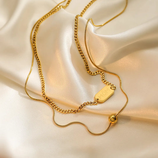 Double layer neckpiece with  MOM carvings